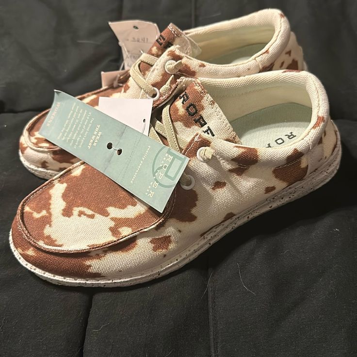 Cow Print Roper Boat Shoes. New With Tags! Size 7. Casual Western Shoes, Cow Hey Dudes, Womens Roper Shoes, Western Upcycle, Western Crocks Shoes, Western Slip On Shoes, Western Crocs Shoes, Western Vans Shoes, Hay Dudes