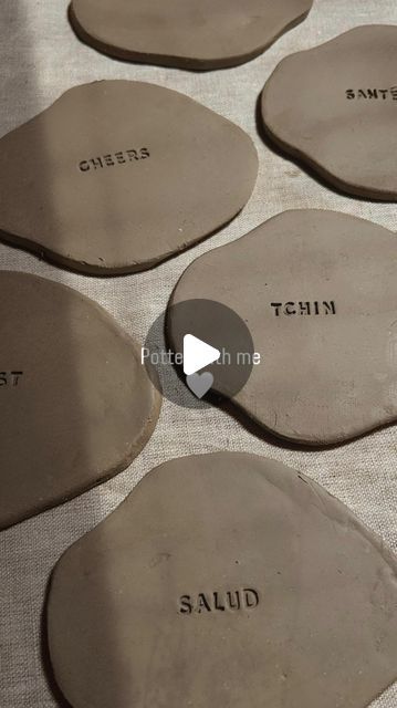 several pieces of pottery sitting on top of a table with words that read, salt and pepper