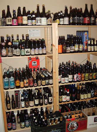 the shelves are filled with many different types of beer