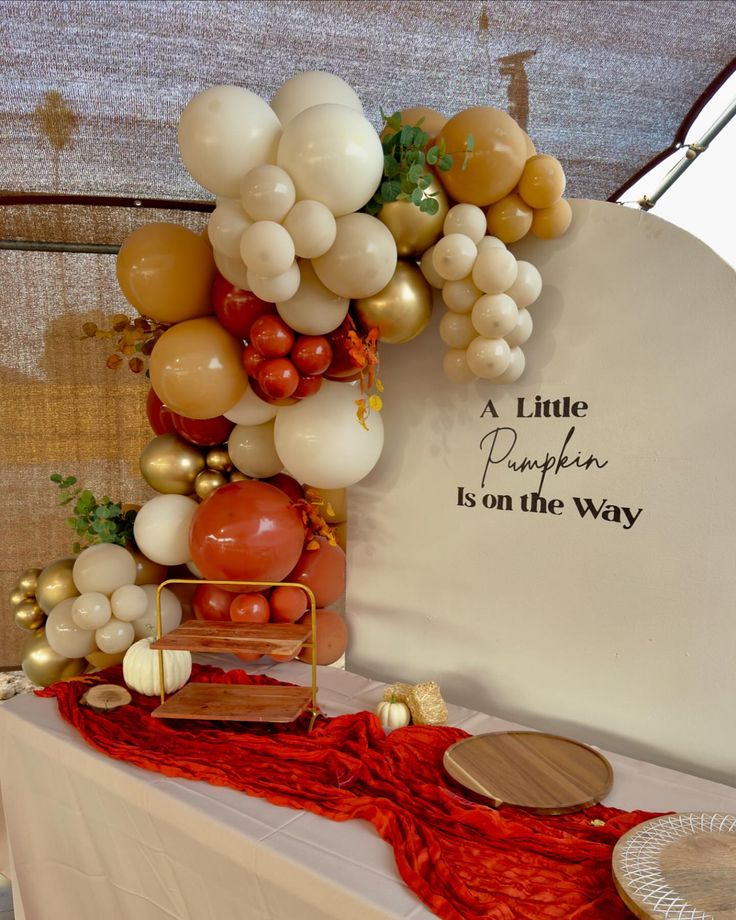 a table topped with balloons and other decorations