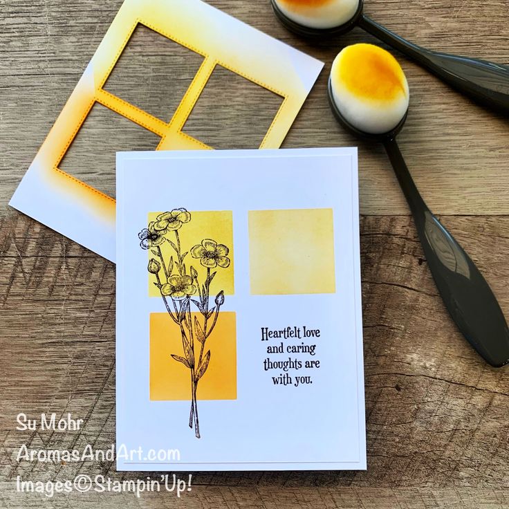 a card with some flowers on it next to eggs and utensils in the background