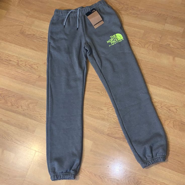 New With Tags, The North Face Coordinates Jogger Pants Size: Xs Color: Tnf Medium Gray Heather We Pull On The North Face's Coordinates Pant When It's Time To Locate The Couch After A Grueling Weekend On The Trail. The Velvety Soft Material Feels Like We're Wrapped In Clouds As We Loll In The Recliner, Dreaming Up Our Next Adventure. Standard Fit Jogger-Style Sweatpant For Kicking Back And Relaxing Cotton-Fleece Blend For Ultrasoft, Eco-Friendly Comfort Standard Fit For Low-Bulk, Low-Bunch Loungi Casual The North Face Pants With Elastic Waistband, Sporty The North Face Bottoms With Pockets, The North Face Casual Pants For Streetwear, Casual The North Face Pants For Streetwear, Casual Streetwear Pants By The North Face, The North Face Elastic Waistband Bottoms For Loungewear, The North Face Loungewear Bottoms With Elastic Waistband, The North Face Relaxed Fit Bottoms For Spring, Sporty Bottoms With Elastic Waistband By The North Face