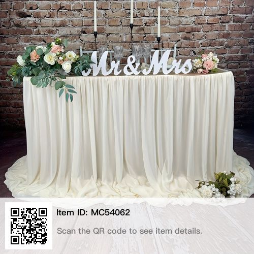 the table is set up with candles and flowers on it for an elegant wedding reception