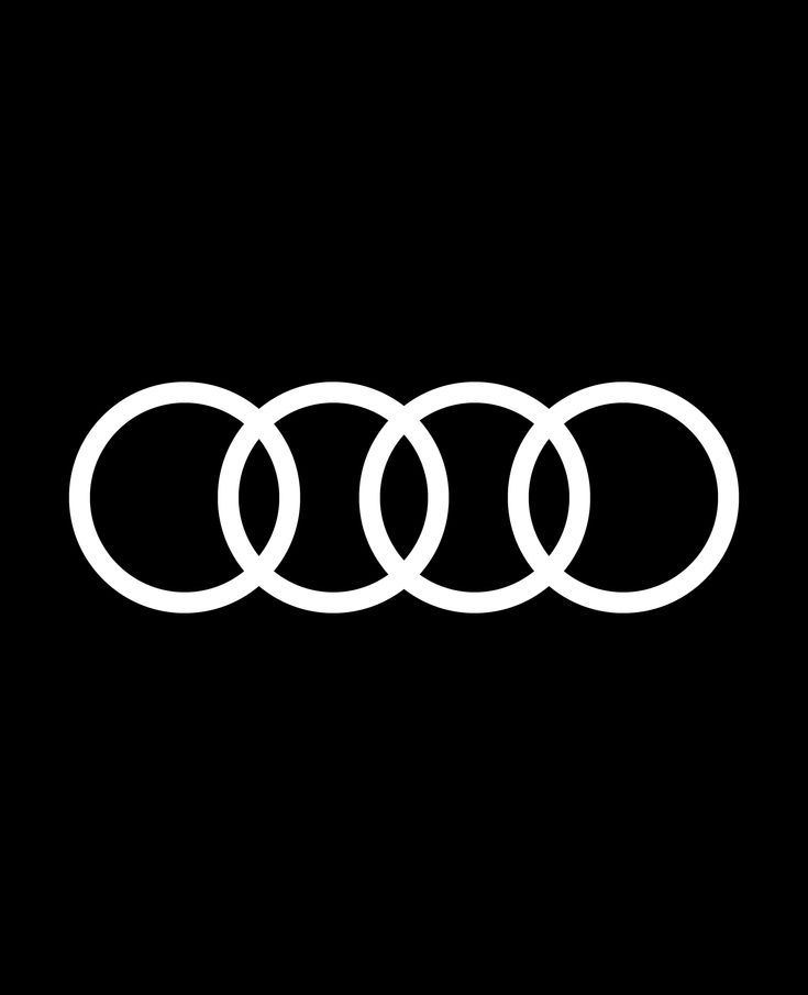 an audi logo on a black background with white circles in the shape of three rings