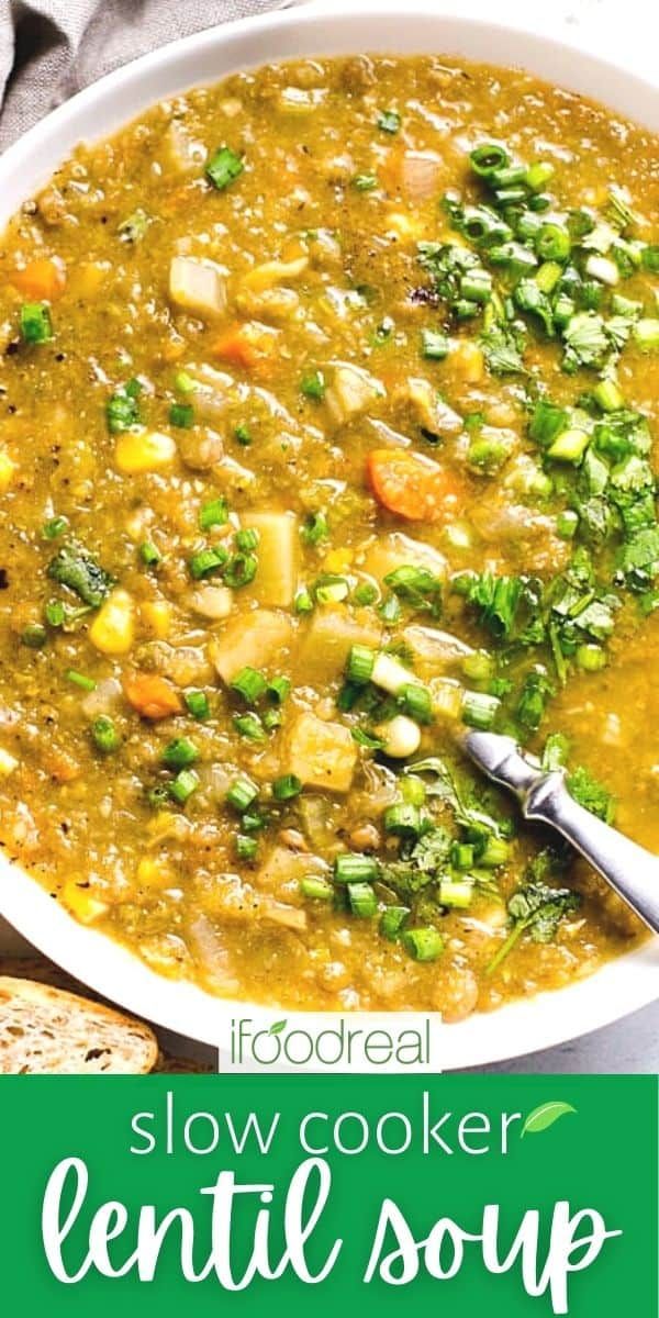 a white bowl filled with soup next to bread