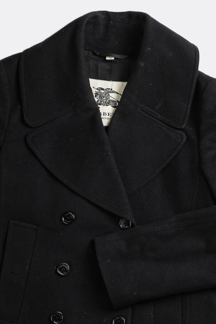 Sourced in CanadaMeasurementsSize: SPit to Pit: 21" Arm: 26"Length: 29.5" Condition: Visible staining on collar, front left pocket, left sleeveMaterial Composition: Main Fabric- 80% wool, 20% cashmere, Main Lining - 50% acetate, 50% viscoseColour: Black Designer Wool Peacoat For Work, Classic Blazer With Padded Collar For Work, Designer Winter Pea Coat With Concealed Placket, Wool Peacoat For Workwear With Long Sleeves, Long Sleeve Wool Peacoat For Work, Designer Long Sleeve Wool Coat For Office, Tailored Fall Peacoat With Pockets, Fall Peacoat With Lapel Collar And Welt Pockets, Designer Collared Winter Outerwear