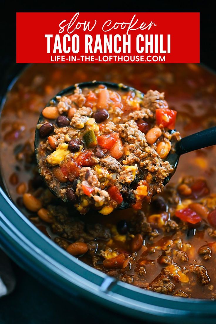 a spoon full of taco ranch chili in a slow cooker with text overlay