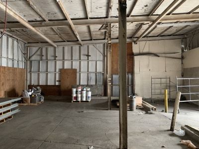 an empty warehouse with lots of wood and metal