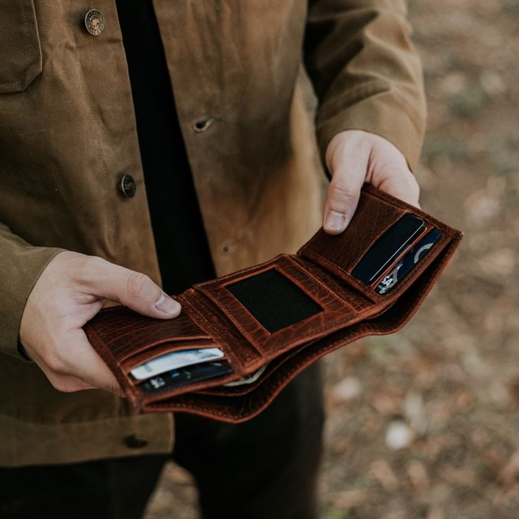 Ryder Reserve Bison Leather Trifold Wallet | Brown Leather Trifold Wallet With Hidden Phone Sleeve For Travel, Leather Trifold Wallet With Card Slots For Travel, Leather Trifold Wallet For Travel, Leather Trifold Wallet With Coin Pocket For Everyday, Brown Bifold Wallet With Hidden Phone Sleeve, Trifold Wallets With Interior Card Slots For Everyday Use, Brown Trifold Wallet For Everyday Carry, Leather Trifold Wallet With Card Slots For Everyday, Trifold Wallets With Leather Lining