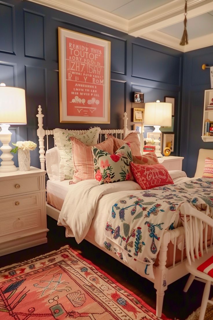 a bedroom with blue walls, white bedding and colorful pillows on the bedspread