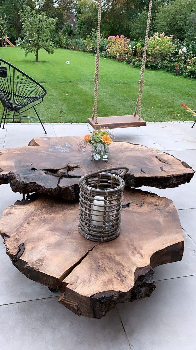 a table made out of tree slices on a patio