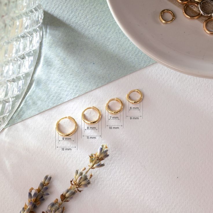 6.0mm 7.0mm 8.0mm 9.0mm Huggies Hoop Earrings in 14K 18K Solid Gold, Tiny Everyday Earrings Gold Hoop Unisex Earrings Gift for Wedding ► Adding a dangling charm to your earring may be a good idea:  https://etsy.me/3CogTdZ Material: Solid Gold (no gold filled or no gold plated material) Available Gold Karat: 14K (585), 18K (750) Available Gold Colors: Yellow, rose and white Available Sizes: Outer diameter: 9 mm, 10 mm, 11 mm, 12 mm  Inner diameter:  6 mm, 7 mm, 8 mm, 9 mm  The sizes may differ sl Tiny 14k Gold Huggie Earrings, Gold 14k Huggie Earrings With Halo, Minimalist Hoop Earrings With Halo Design, Gold Round Huggie Earrings With Halo, 14k Gold Round Huggie Earrings With Halo, Gold Huggie Earrings With Halo, Gold Huggie Cartilage Earrings For Wedding, Gold Hypoallergenic Huggie Earrings, Gold Round Halo Huggie Earrings