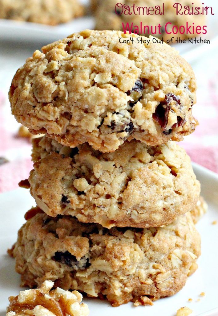 three oatmeal raisin walnut cookies stacked on top of each other