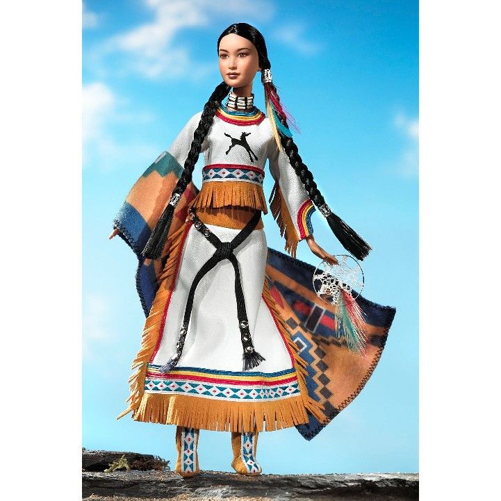 the doll is dressed in native clothing