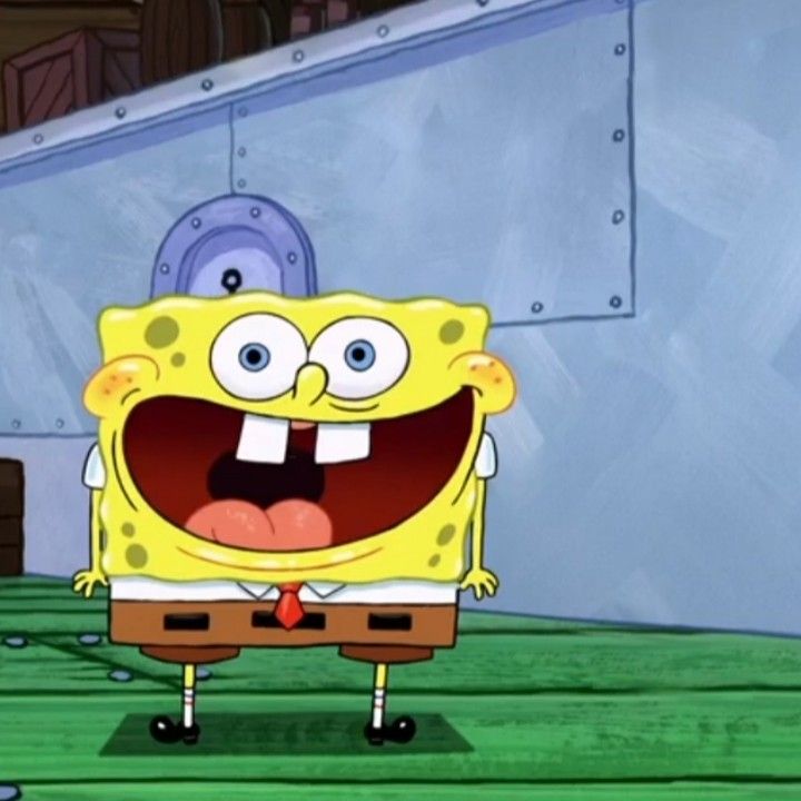 spongebob with his mouth open and tongue out in front of him, standing on a green floor