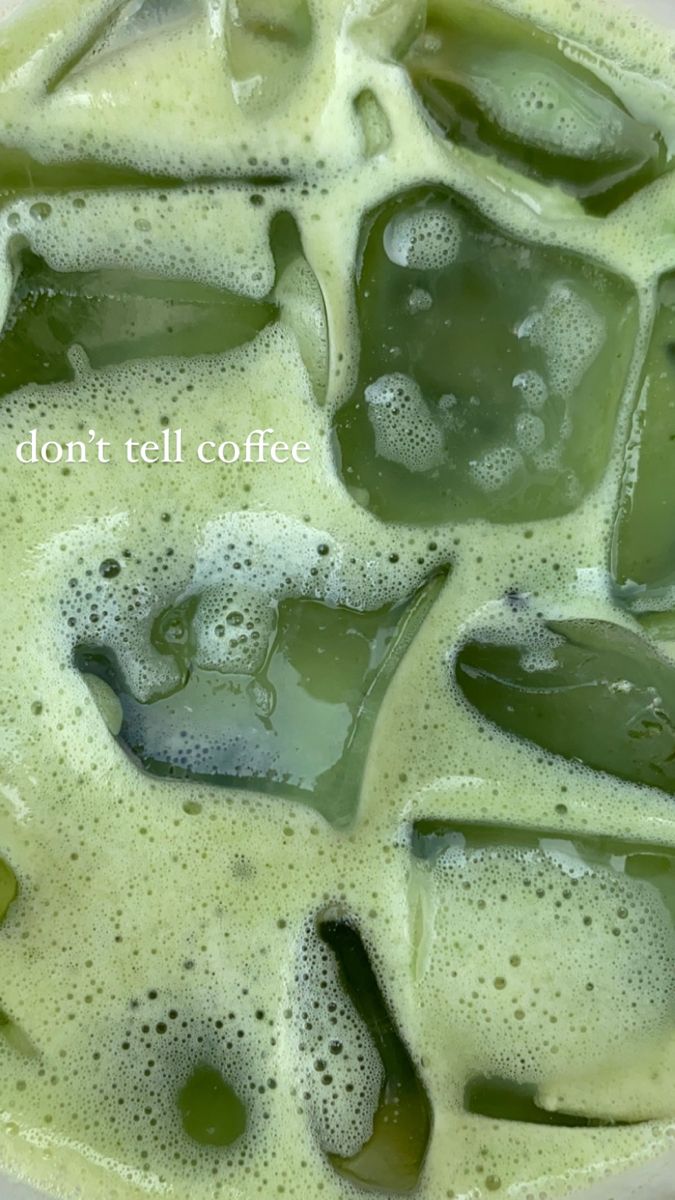 green liquid in a white bowl filled with ice