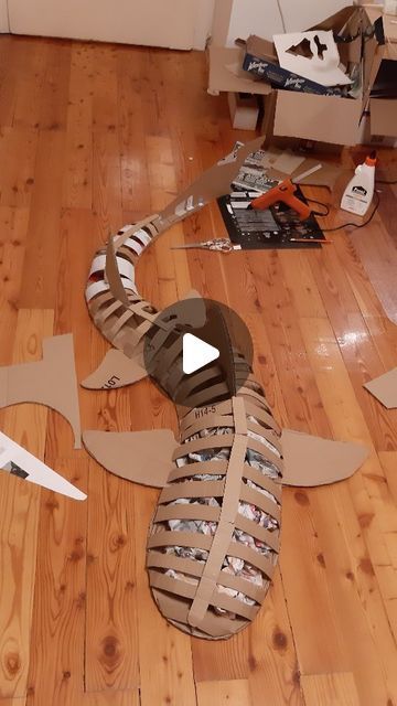 cardboard cut out shoes sitting on top of a wooden floor