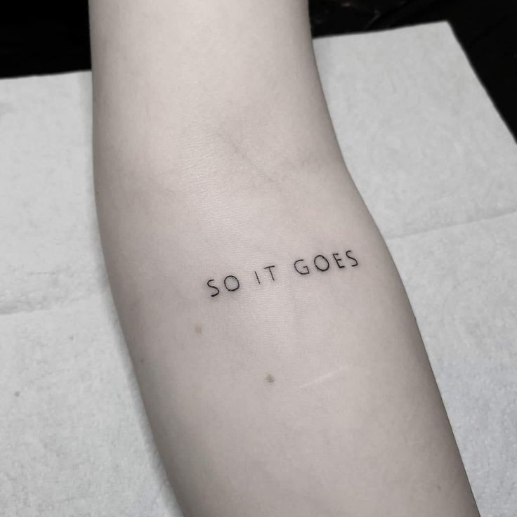 a person's arm with the word so it goes written on it, in black ink