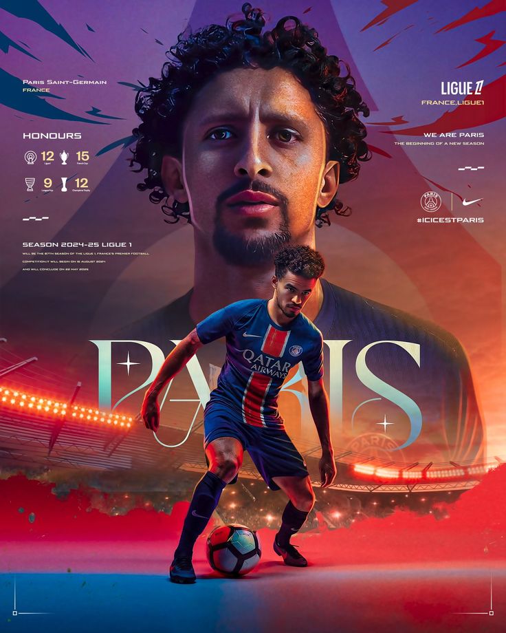 a man with curly hair and beard standing next to a soccer ball in front of a stadium