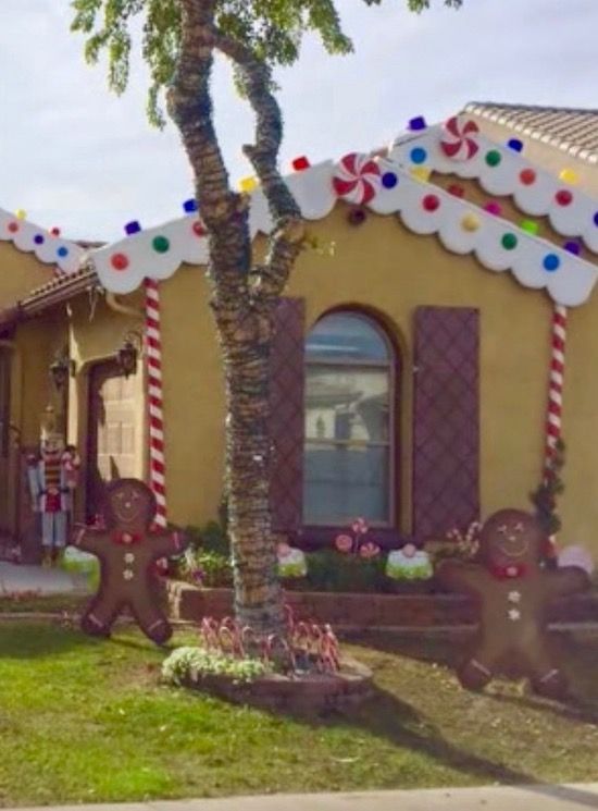 gingerbread houses decorated with candy canes and decorations