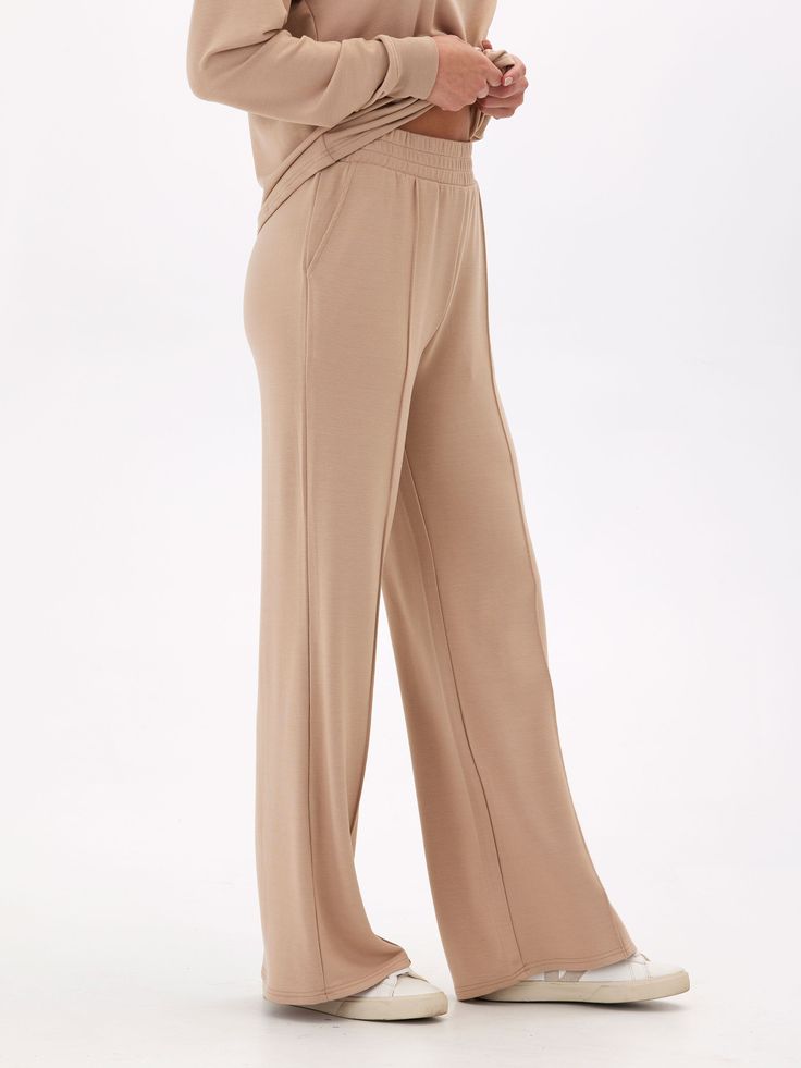 Elevate your loungewear game with our Angela Modal Terry Wide Leg Pants! Made with a buttery soft material and featuring a thick stretchy waistband, these pants offer both comfort and style. The wide leg design adds a touch of elegance to your casual look. Don't settle for ordinary loungewear, treat yourself to our elevated piece. Comfortable Solid Color Pants For Lounging, Comfortable Pants For Lounging, Soft Texture Loungewear Bottoms For Spring, Soft Texture Bottoms For Spring Loungewear, Solid Color Comfort Stretch Pants For Relaxation, Comfort Stretch Pants For Relaxation, Comfortable Solid Yoga Pants With Elastic Waistband, Comfort Waistband Yoga Pants For Lounging, Solid Yoga Pants With Elastic Waistband For Relaxation