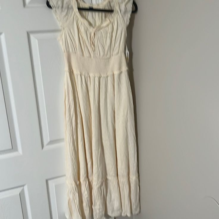 Gap Cream Cotton Dress Beige Fitted Maxi Sundress, Fitted Beige Maxi Sundress, Cream A-line Maxi Dress For Spring, Cream A-line Maxi Dress For Summer, Beige Lined Midi Dress, Casual Flowy Empire Waist Maxi Dress, Chic Cream Maxi Length Sundress, Casual Cream A-line Dress, Chic Beige Empire Waist Dress