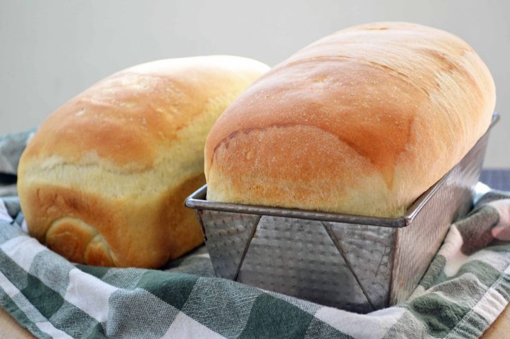 two loaves of bread sitting on top of a table