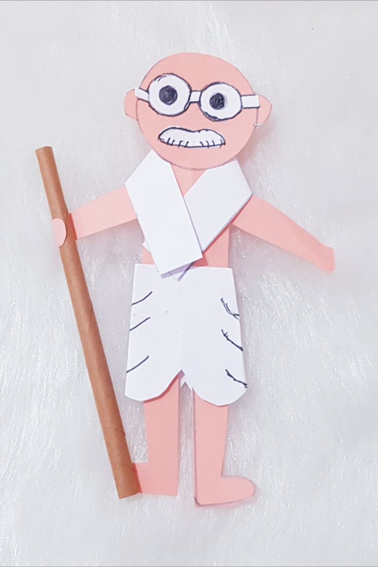 a paper cut out of a man holding a stick