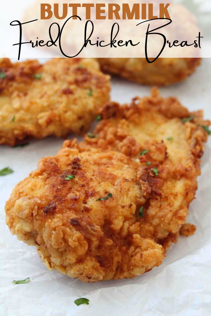 fried chicken breast is cut in half and placed on top of paper with the words buttermik fried chicken breast