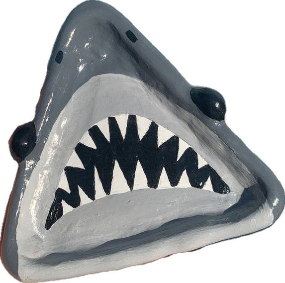 a close up of a shark mask on a white background