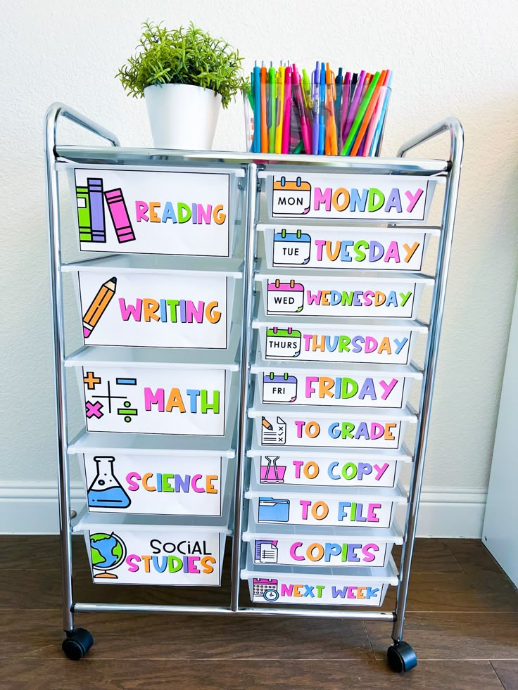 a metal cart with lots of writing on it and some books in front of it