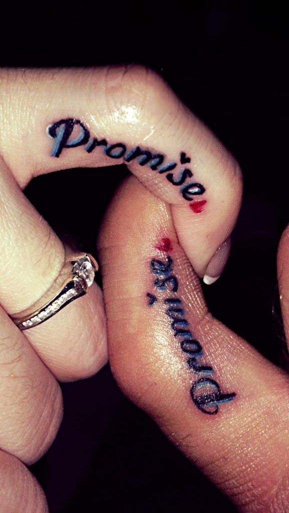 two people holding hands with tattoos on their fingers and the words prom written on them