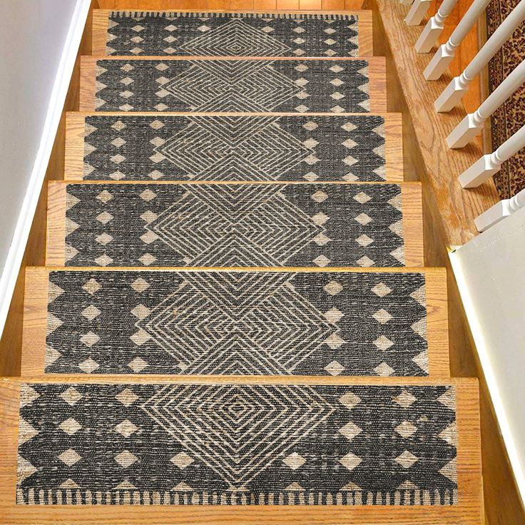 the stairs are decorated with rugs on them