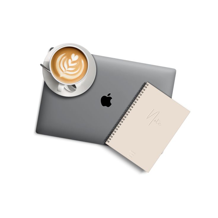 a cup of coffee sitting on top of a laptop computer next to a notepad