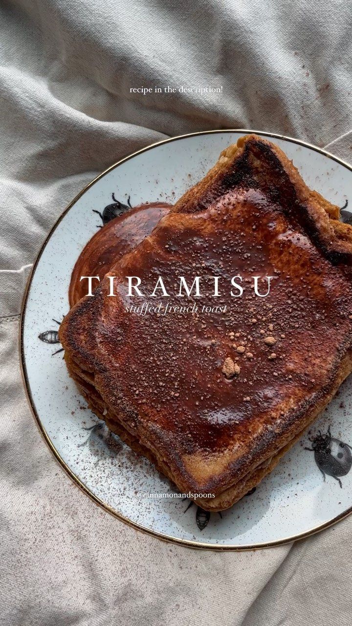 a piece of toast on a plate with the word tramisu written in it