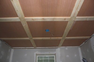 an unfinished bathroom with the ceiling exposed