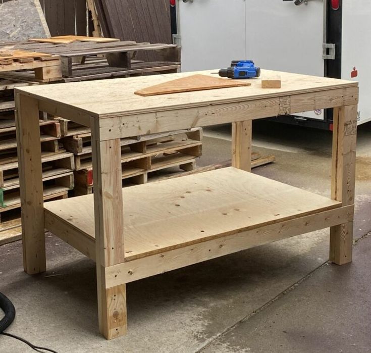 a workbench made out of wooden pallets