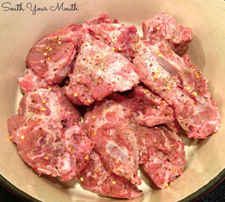 raw meat in a bowl with seasoning on top