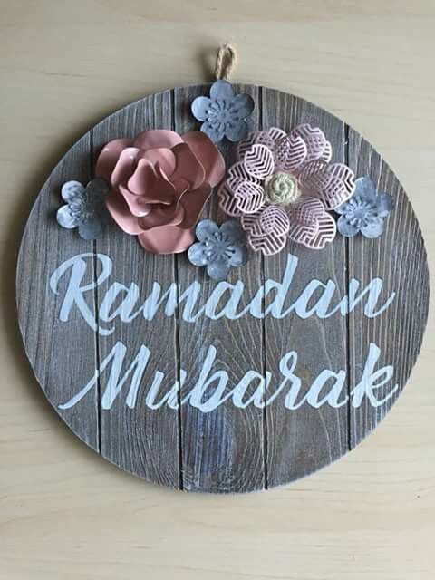 a wooden sign with flowers on it that says raman mikraka and the words