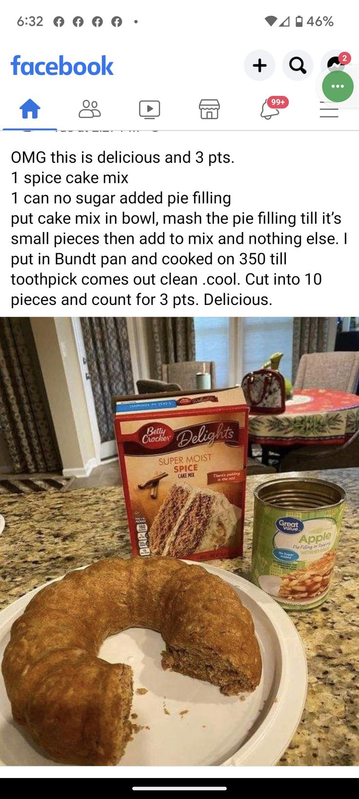 a white plate topped with a piece of cake next to a box of cookies and a bag of chips