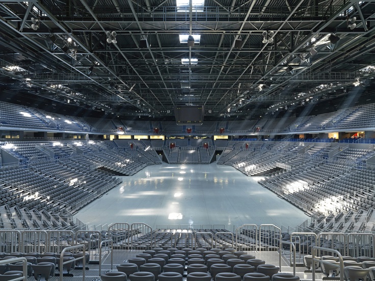 an empty stadium filled with lots of chairs