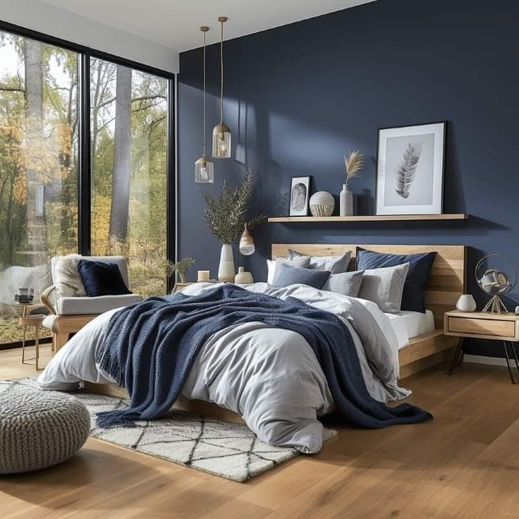 a bedroom with blue walls and wooden floors