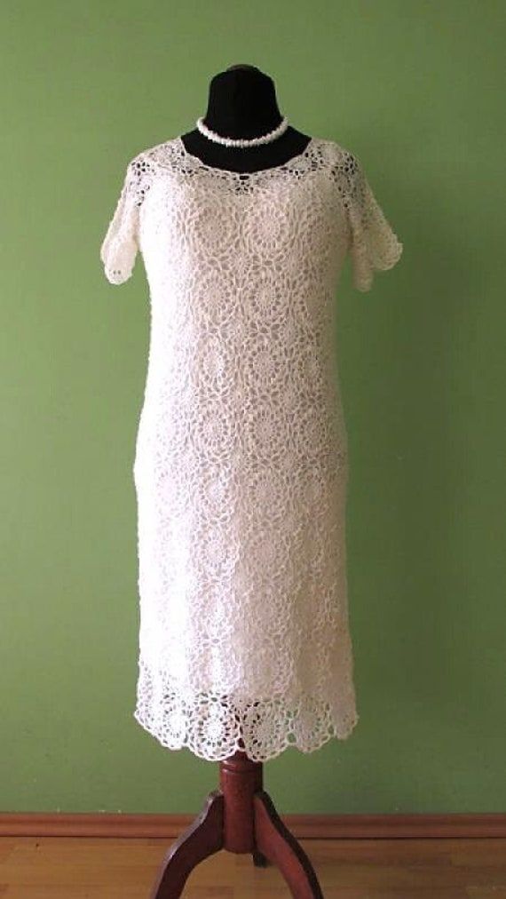 Lovely crochet lace dress in pure white color. Sensuously shaped. Linen.  Unique OOAK  wedding dress. Every item in the shop is personally made by myself in my home. Material: high quality cotton yarn Size: XL ( 18) Bust: 102 cm = 40.2 inches up to 106 cm = 41.7 inches Lenght of dress from arm : 106 cm = 41.7 inches Hips: 110 cm = 43.3 inches Please, feel free to contact me for further information. Thank you very much for your interest :) White Crochet Wedding Dress, Wedding Crochet Lace Dresses, Fitted White Crochet Dress With Lace Work, Elegant White Crochet Lace Dress, Fitted White Crochet Dress For Wedding, Elegant Cream Crochet Lace Dress, Crochet Wedding Dress, Lace Dress White, Crochet Wedding Dresses