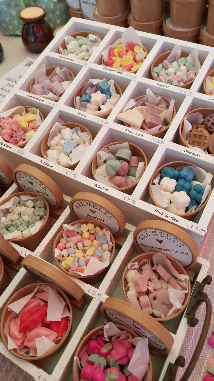 many different types of candies in wooden bowls