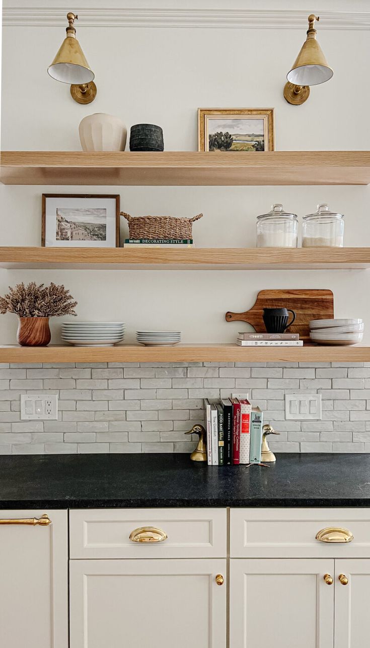 the kitchen is clean and ready for us to use it's shelves are lined with books