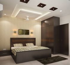 a bedroom with a large bed in the center and lights on the ceiling above it