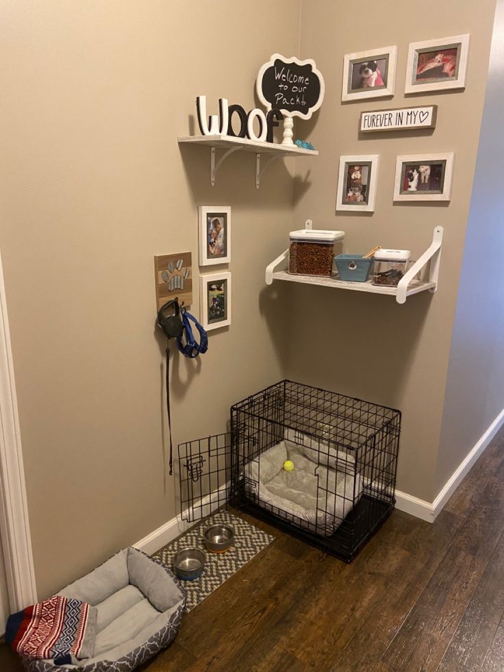 a dog bed and cage in the corner of a room