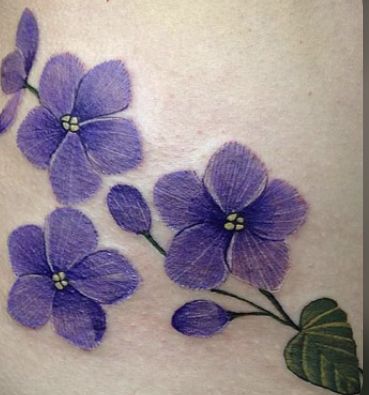 purple flowers on the side of a woman's stomach