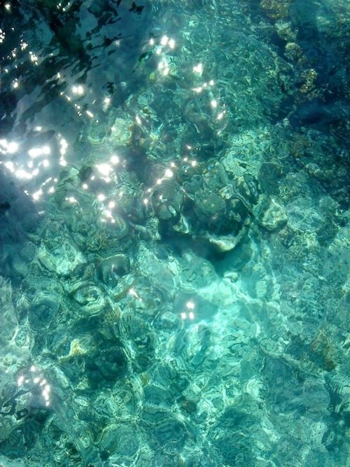 the water is crystal clear and blue