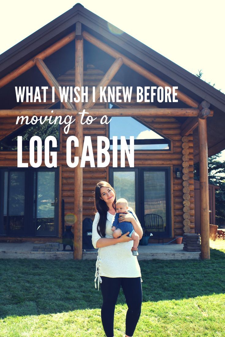 a woman holding a baby in her arms with the words what i wish i knew before moving to a log cabin